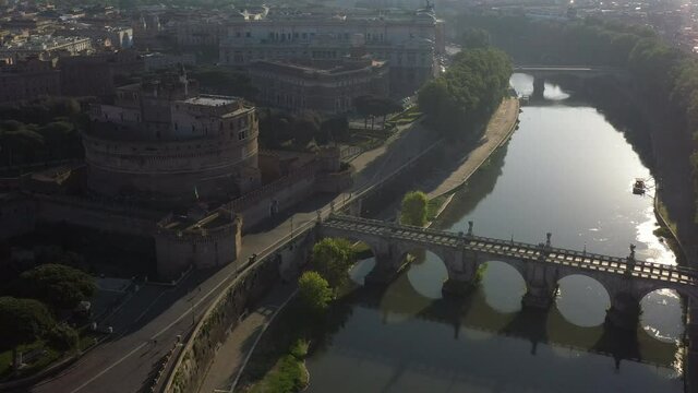 Aerial view of Castel Sant'Angelo, famous landmark in Rome, Italy. The Mausoleum of Hadrian in Roma seen from drone flying in sky, with river Tiber. Old building and urban landscape of Italian city