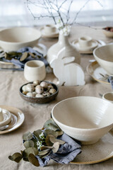 Easter dinner table setting with ceramic tableware