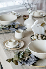 Obraz na płótnie Canvas Easter dinner table setting with ceramic tableware