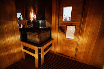 sauna with beautiful lighting. steam room in a traditional Finnish sauna. healthy rest and relaxation. interior decorated with wood
