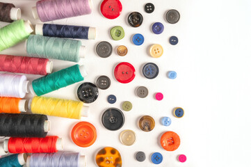 Sewing accessories. Sewing equipment. Colorful threads and buttons. Copy space