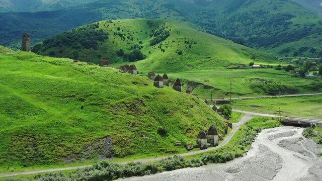 Aerial view of Dead Town Dargavs In North Ossetia. The ancient cemetery of the Alans. Many small stone mausoleums, 4k