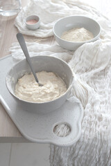Bowl of dough on a cutting board