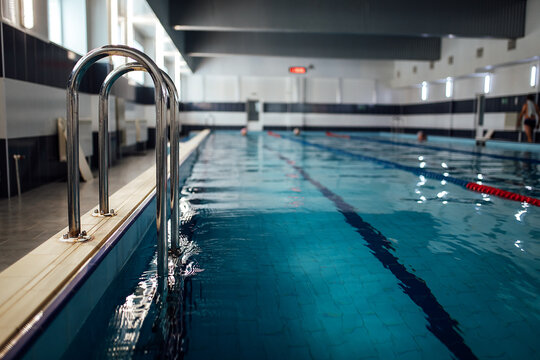 swimming pool for swimming in the gym. clean and cold water in the indoor pool - Powered by Adobe
