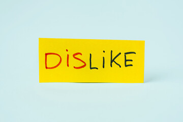 DISLIKE inscription on yellow paper, with the ability to cut off " LIKE"