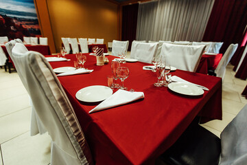 served tables in the restaurant. reception hall for guests at the festival. interior of an expensive restaurant
