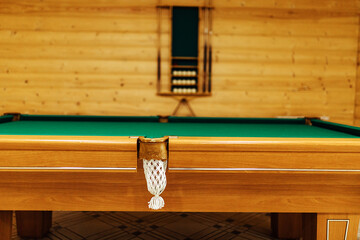 pool table in the sauna. recreation and sports entertainment sports entertainment during your vacation. wooden table with green cloth in a private house