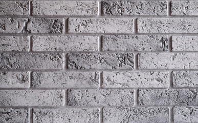Fragment of a wall of gray brick. Brick background close-up.