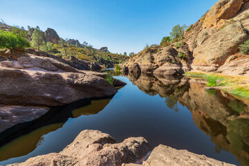 Lake Bear Gulch and rock formations in Pinnacles National Park in California, the ruined remains of an extinct volcano on the San Andreas Fault. Beautiful landscapes