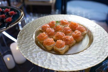 canapes with salmon, cheese and vegetables