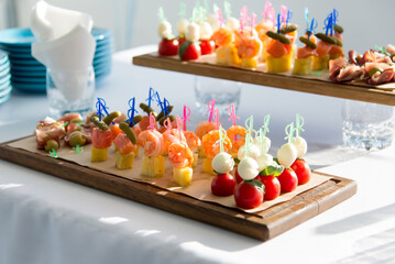 canapes with salmon, cheese and vegetables