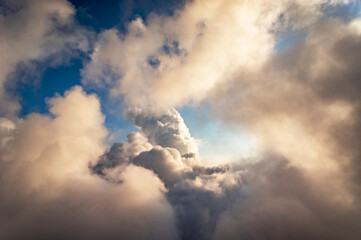 Beautiful blue sky with cumulus rainy clouds, abstract background, copy space, cloudscape