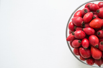Rose-hips or wild rose berries isolated on a white background.