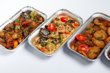 Business lunch in eco plastic container ready for delivery.Top view. Office Lunch boxes with food ready to go. Food takes away. Catering, brakfast.