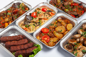 Business lunch in eco plastic container ready for delivery.Top view. Office Lunch boxes with food ready to go. Food takes away. Catering, brakfast.