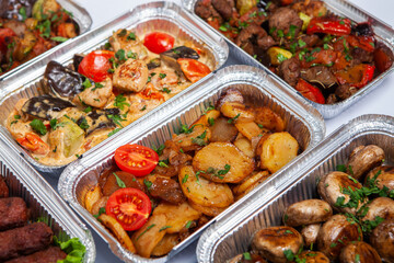 Business lunch in eco plastic container ready for delivery.Top view. Office Lunch boxes with food ready to go. Food takes away. Catering, brakfast.