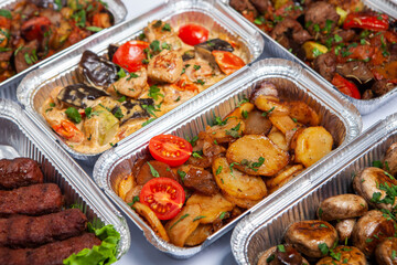 Business lunch in eco plastic container ready for delivery.Top view. Office Lunch boxes with food ready to go. Food takes away. Catering, brakfast.