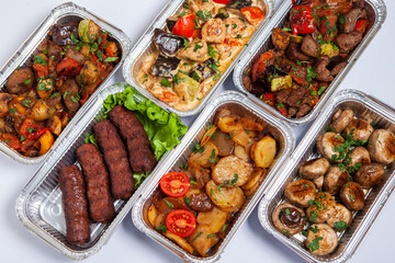 Business lunch in eco plastic container ready for delivery.Top view. Office Lunch boxes with food ready to go. Food takes away. Catering, brakfast.