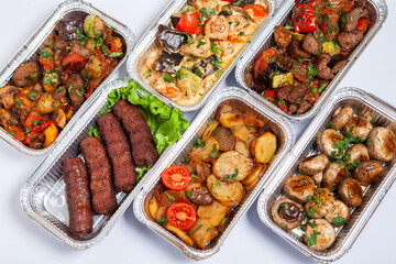 Business lunch in eco plastic container ready for delivery.Top view. Office Lunch boxes with food ready to go. Food takes away. Catering, brakfast.