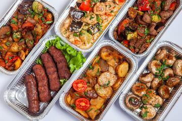 Business lunch in eco plastic container ready for delivery.Top view. Office Lunch boxes with food ready to go. Food takes away. Catering, brakfast.