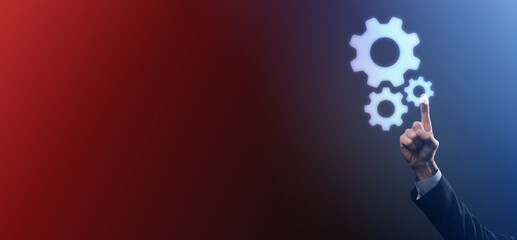 Business man in suit holding metal gears and cogwheels mechanism representing interaction teamwork concept,hand hold group of virtual cog gears wheel.