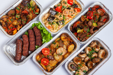 Business lunch in eco plastic container ready for delivery.Top view. Office Lunch boxes with food ready to go. Food takes away. Catering, brakfast.