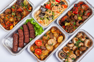 Business lunch in eco plastic container ready for delivery.Top view. Office Lunch boxes with food ready to go. Food takes away. Catering, brakfast.