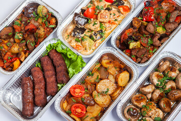 Business lunch in eco plastic container ready for delivery.Top view. Office Lunch boxes with food ready to go. Food takes away. Catering, brakfast.