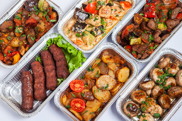 Business lunch in eco plastic container ready for delivery.Top view. Office Lunch boxes with food ready to go. Food takes away. Catering, brakfast.