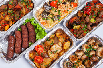 Business lunch in eco plastic container ready for delivery.Top view. Office Lunch boxes with food ready to go. Food takes away. Catering, brakfast.