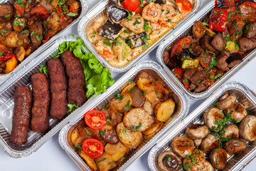 Business lunch in eco plastic container ready for delivery.Top view. Office Lunch boxes with food ready to go. Food takes away. Catering, brakfast.