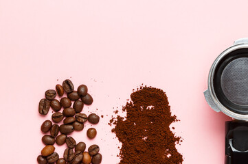 Detail of espresso machine filter, ground coffee and coffee beans.