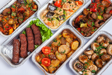 Business lunch in eco plastic container ready for delivery.Top view. Office Lunch boxes with food ready to go. Food takes away. Catering, brakfast.