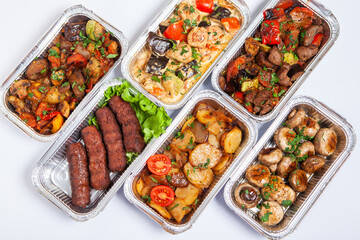 Business lunch in eco plastic container ready for delivery.Top view. Office Lunch boxes with food ready to go. Food takes away. Catering, brakfast.