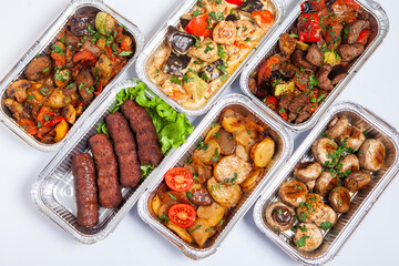 Business lunch in eco plastic container ready for delivery.Top view. Office Lunch boxes with food ready to go. Food takes away. Catering, brakfast.