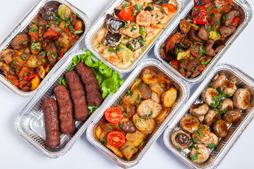 Business lunch in eco plastic container ready for delivery.Top view. Office Lunch boxes with food ready to go. Food takes away. Catering, brakfast.