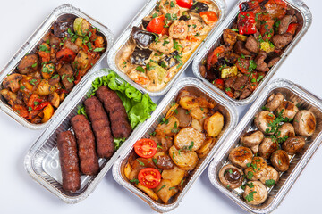Business lunch in eco plastic container ready for delivery.Top view. Office Lunch boxes with food ready to go. Food takes away. Catering, brakfast.