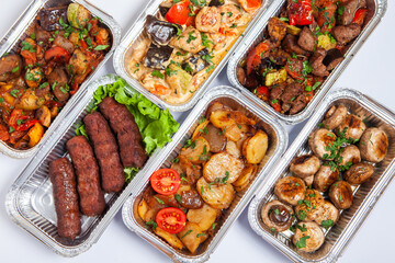 Business lunch in eco plastic container ready for delivery.Top view. Office Lunch boxes with food ready to go. Food takes away. Catering, brakfast.