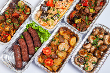 Business lunch in eco plastic container ready for delivery.Top view. Office Lunch boxes with food ready to go. Food takes away. Catering, brakfast.