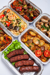 Business lunch in eco plastic container ready for delivery.Top view. Office Lunch boxes with food ready to go. Food takes away. Catering, brakfast.