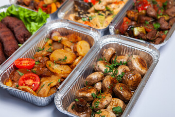 Business lunch in eco plastic container ready for delivery.Top view. Office Lunch boxes with food ready to go. Food takes away. Catering, brakfast.