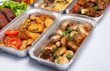 Business lunch in eco plastic container ready for delivery.Top view. Office Lunch boxes with food ready to go. Food takes away. Catering, brakfast.