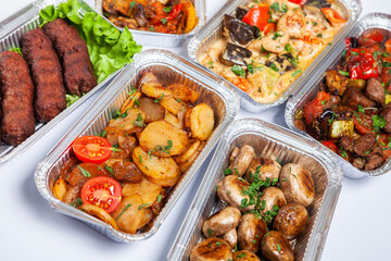Business lunch in eco plastic container ready for delivery.Top view. Office Lunch boxes with food ready to go. Food takes away. Catering, brakfast.