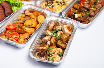 Business lunch in eco plastic container ready for delivery.Top view. Office Lunch boxes with food ready to go. Food takes away. Catering, brakfast.