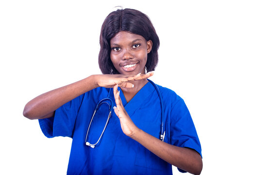 Beautiful Young Female Doctor Showing A Timeout Gesture.