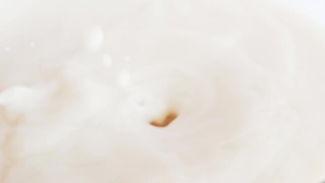 hazelnut chocolate falling into milk