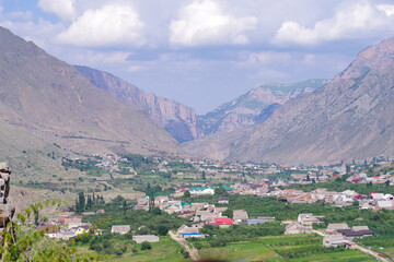 Fototapeta na wymiar View from the mountain to the village of Verkhnyaya Balkaria and the Cherek valley