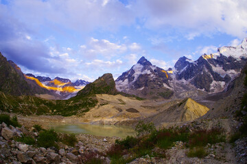 Lake Bashkara Upper on the background of the mountain ranges of the Caucasian Wall in the Elbrus region