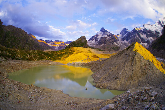 Sunset on Lake Bashkara against the background of the Caucasian Wall in the Elbrus region
