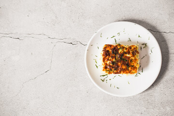 cabbage pie on a grey table. Flat lay top-down